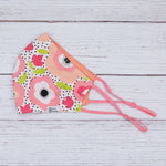 Riley with Polka Dotted Coral Reversible Mask